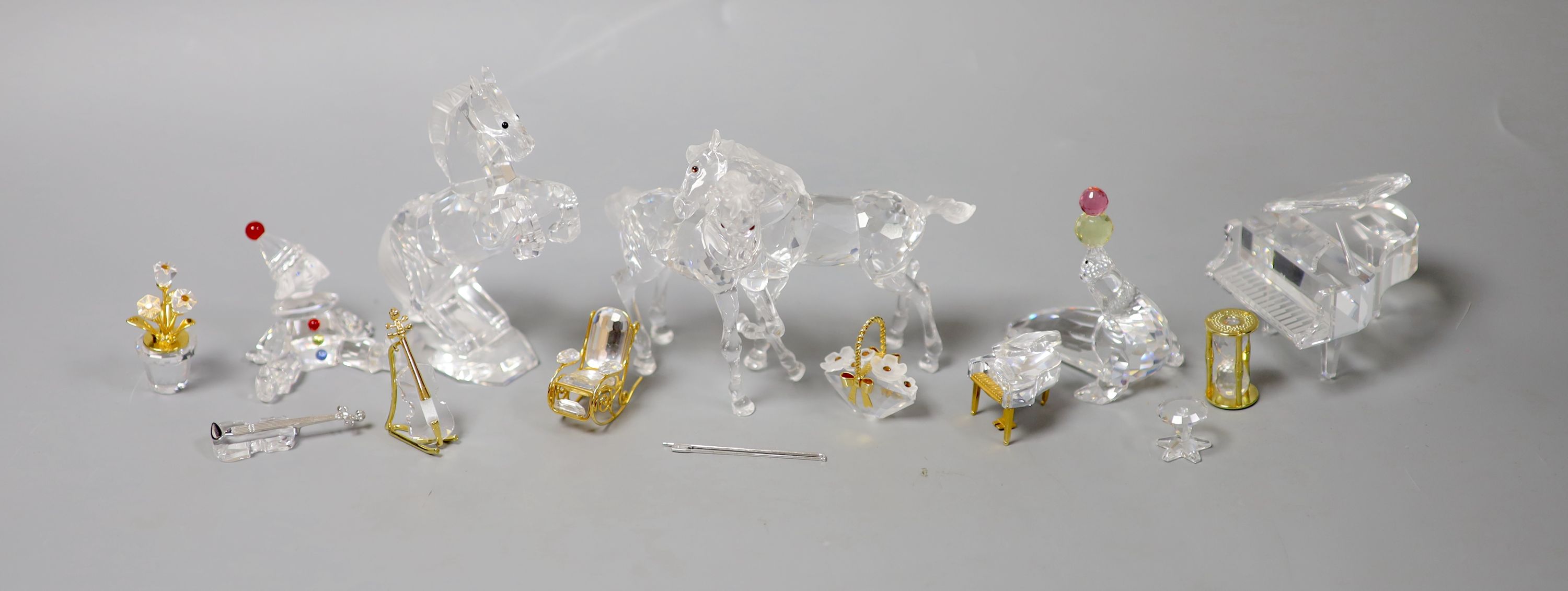Thirteen Swarovski crystals including Pair of Horses and Seated Clown
